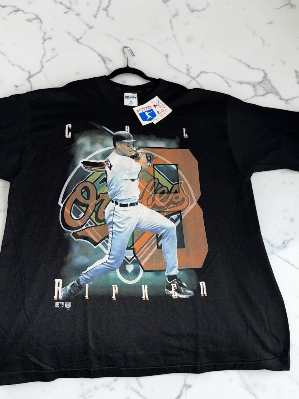 DRIPPING IN VINTY black cotton t-shirt featuring a vintage graphic of Cal Ripken Jr in his Baltimore Orioles uniform.