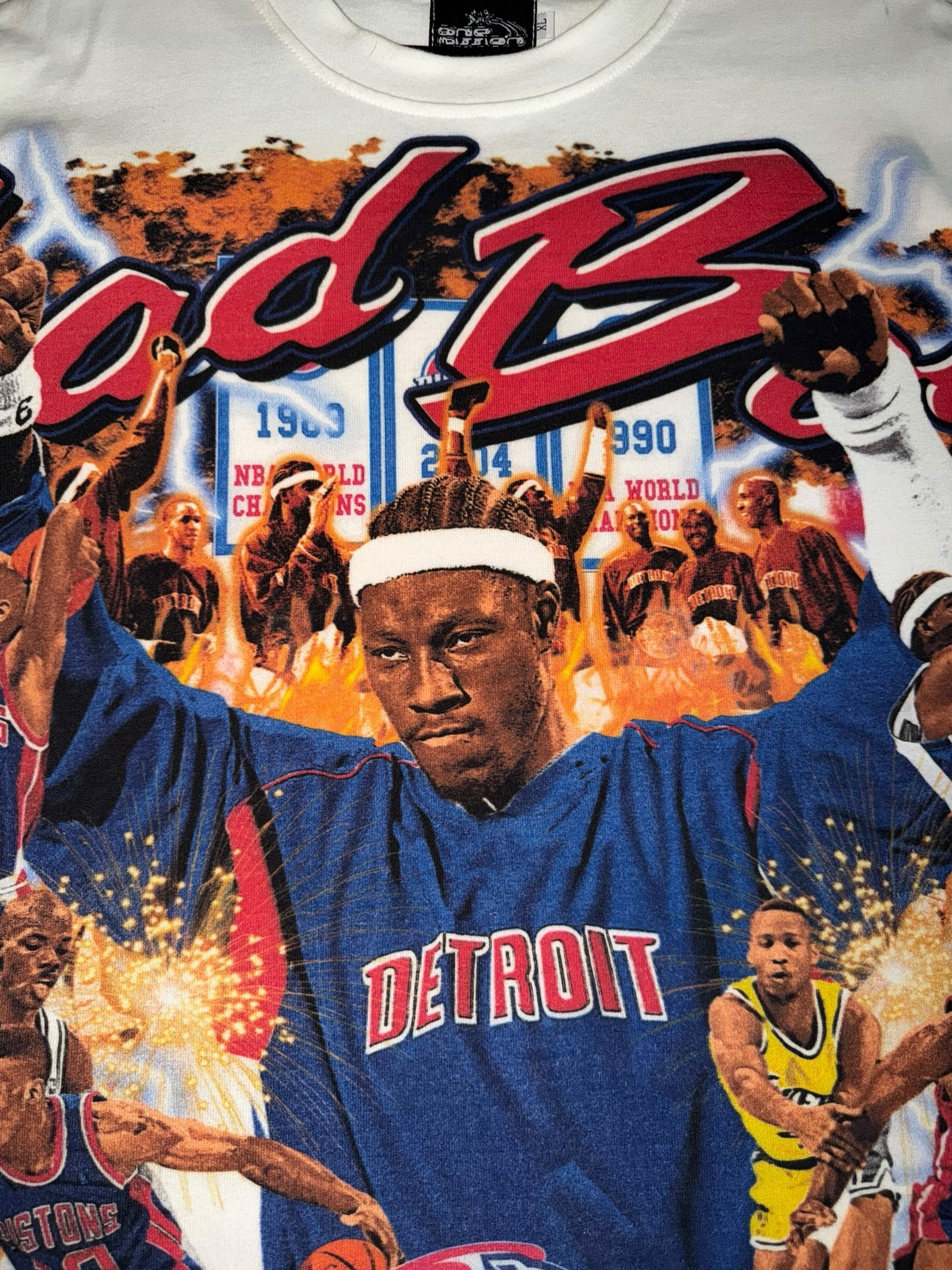 DRIPPING IN VINTY off-white graphic t-shirt featuring Detroit Pistons Bad Boys era basketball collage and championship banners