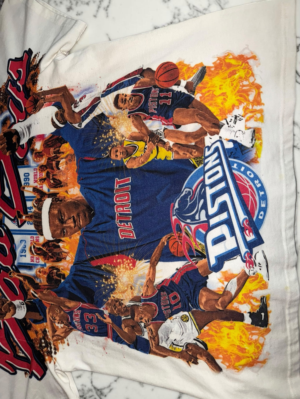 DRIPPING IN VINTY off-white vintage Detroit Pistons graphic t-shirt featuring Bad Boys era basketball player prints