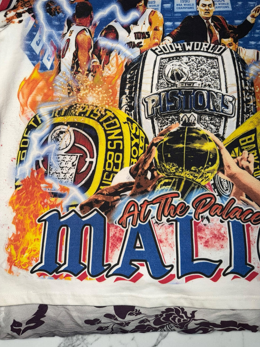 DRIPPING IN VINTY off-white t-shirt with vintage Detroit Pistons Bad Boys era graphic print and championship rings
