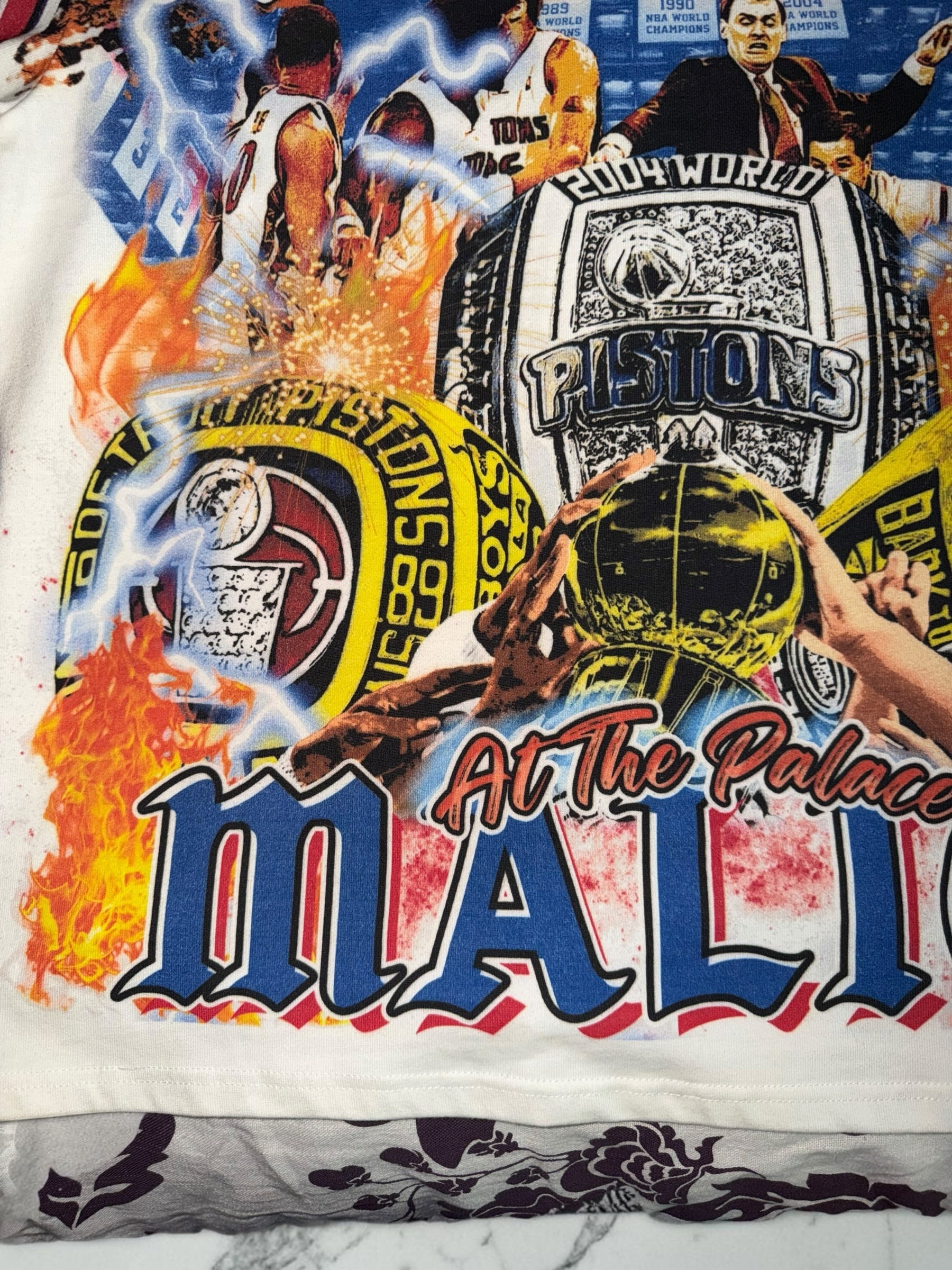 DRIPPING IN VINTY off-white t-shirt with vintage Detroit Pistons Bad Boys era graphic print and championship rings