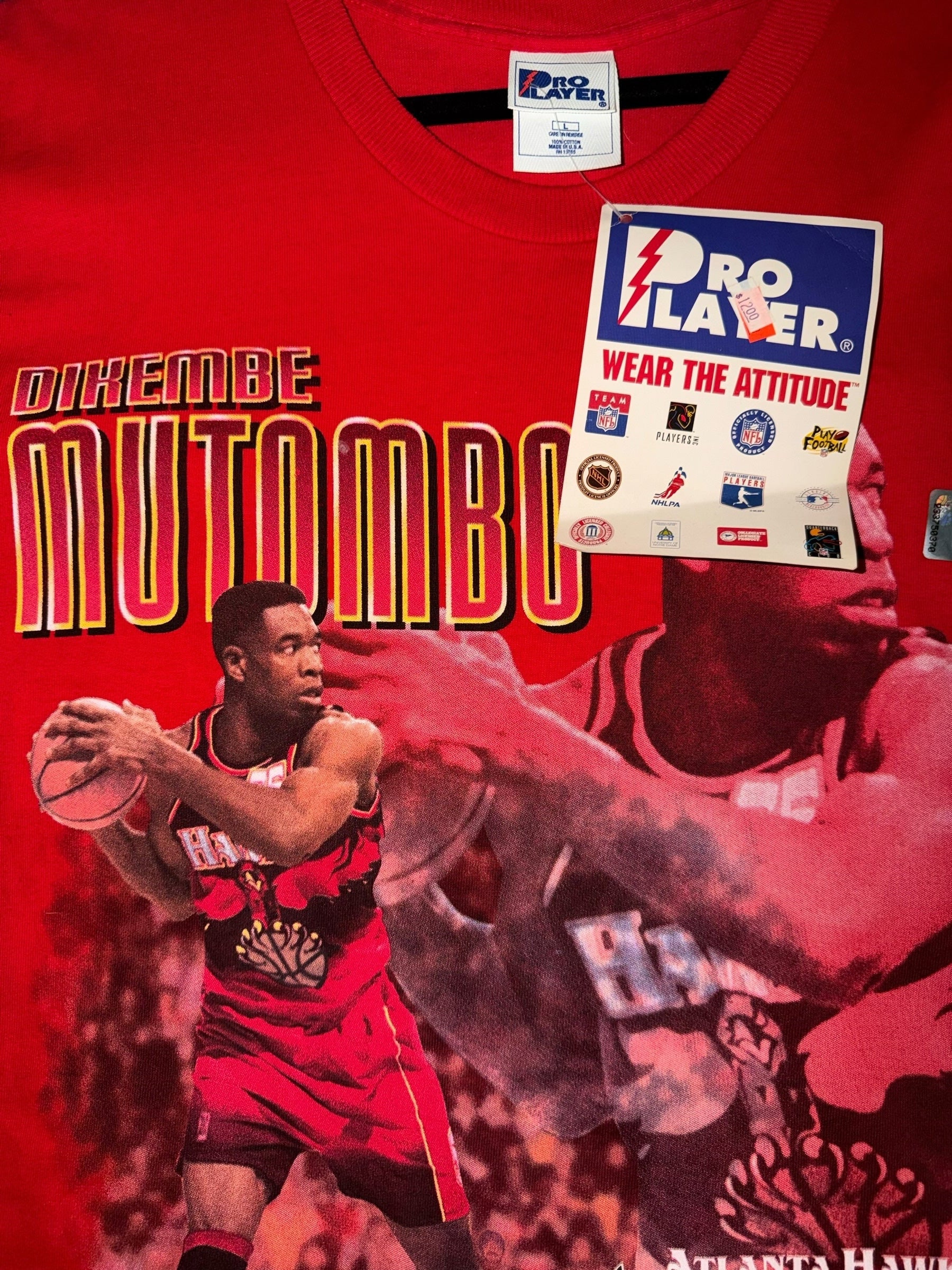 DRIPPING IN VINTY red Pro Player Dikembe Mutombo Atlanta Hawks graphic t-shirt with original tags and crew neck