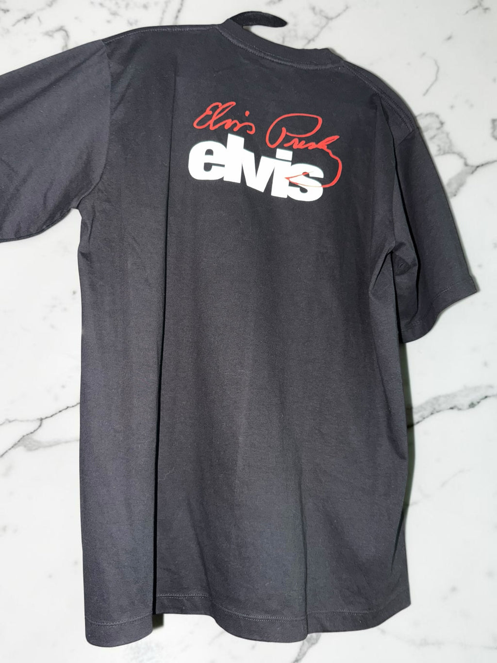 DRIPPING IN VINTY black cotton crewneck t-shirt featuring a white Elvis logo and red signature on the back