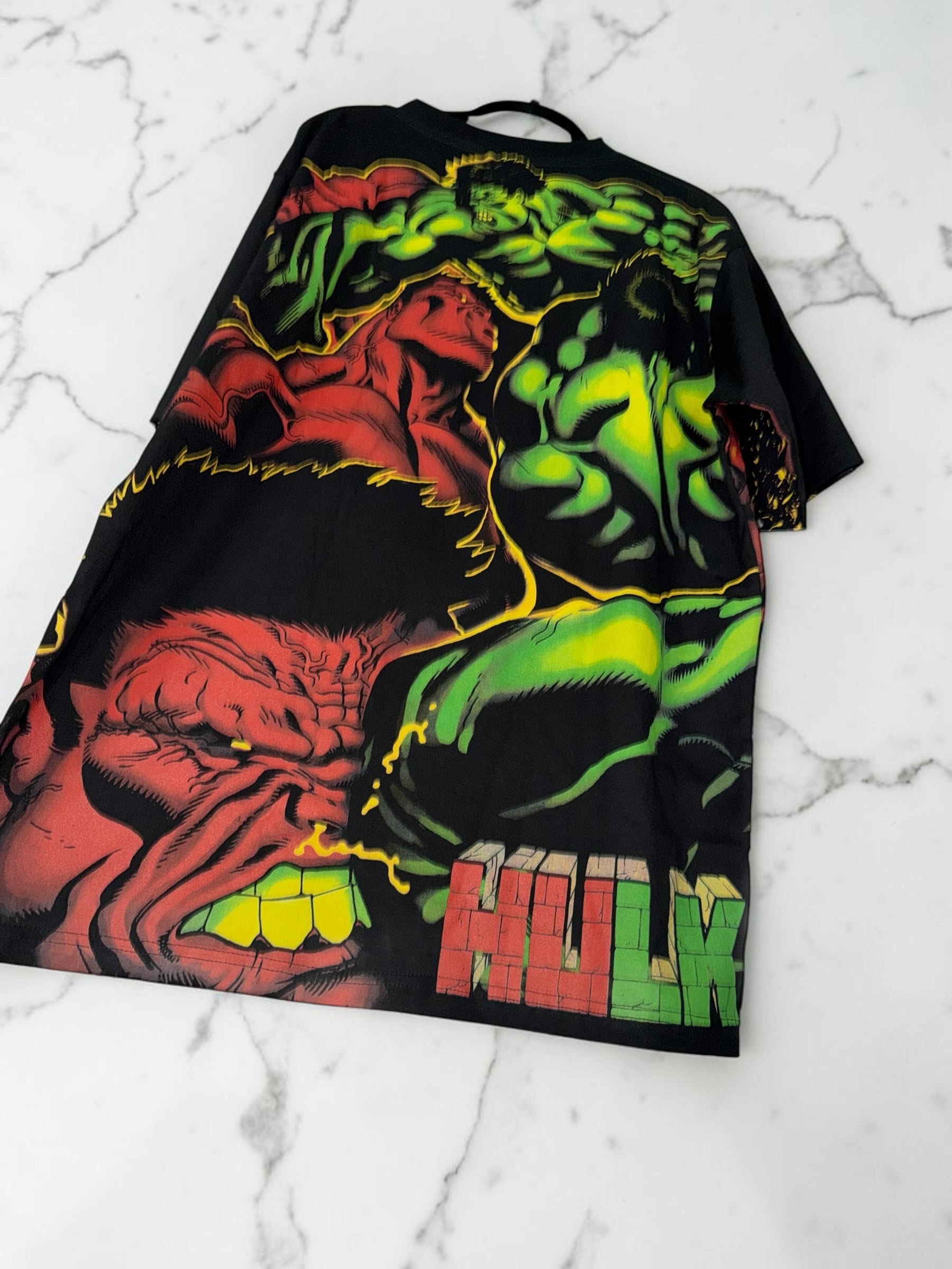 DRIPPING IN VINTY black short sleeve t-shirt featuring a vibrant red and green Hulk comic book graphic print