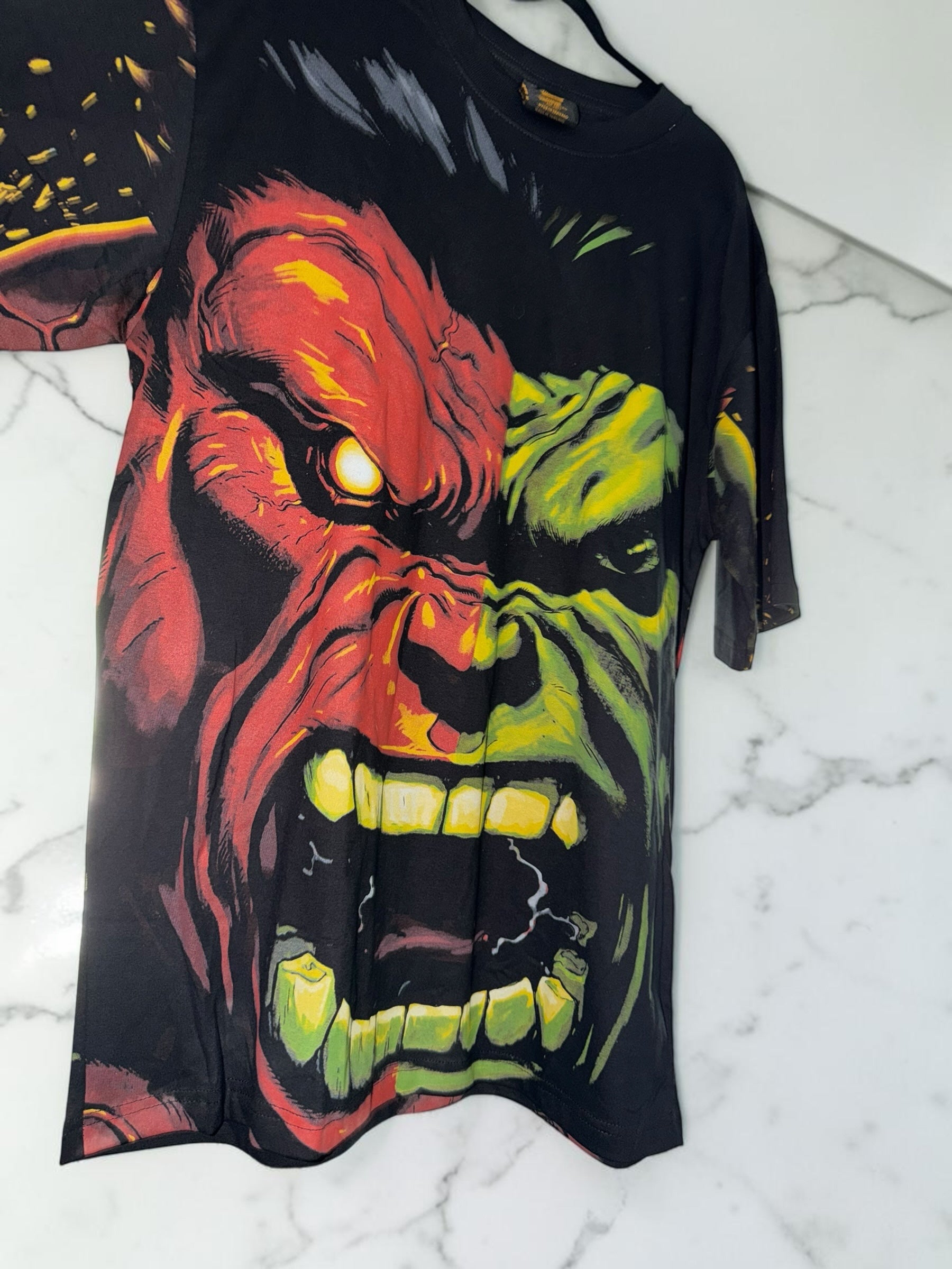 DRIPPING IN VINTY black short sleeve t-shirt featuring a large, high-contrast red and green Hulk graphic print.