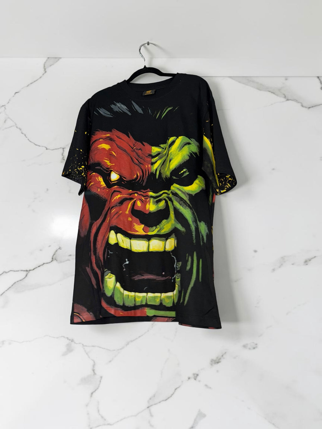 DRIPPING IN VINTY black short sleeve t-shirt featuring a large, vibrant red and green Hulk graphic print.