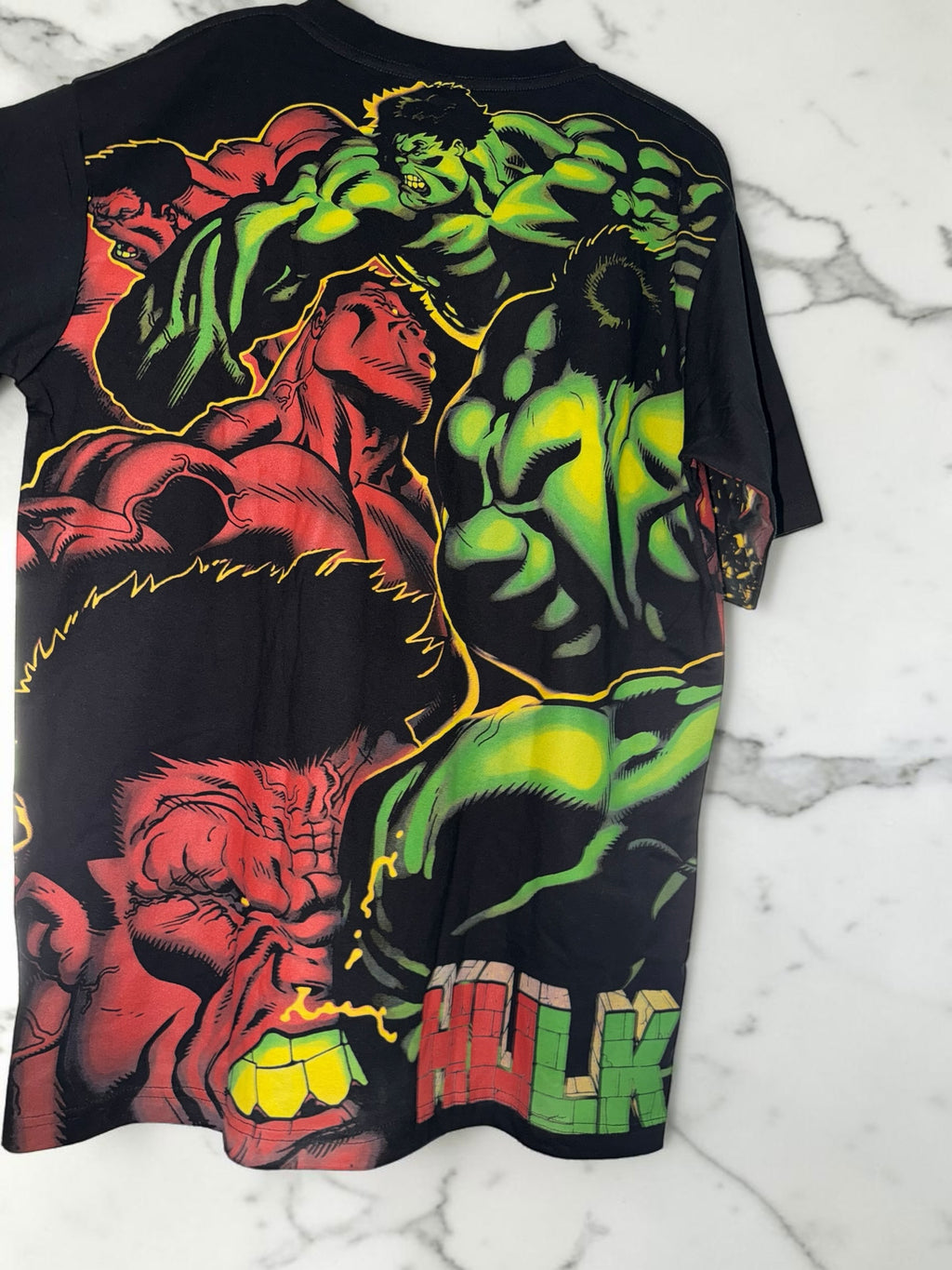 DRIPPING IN VINTY black short sleeve t-shirt featuring a vibrant red and green Hulk comic book collage graphic print