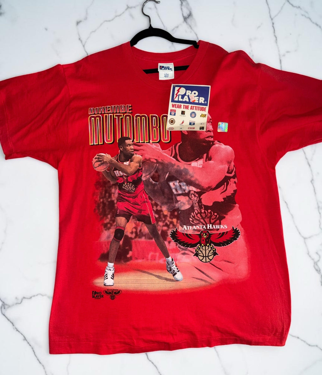 DRIPPING IN VINTY red cotton t-shirt featuring a vintage Dikembe Mutombo Atlanta Hawks graphic print