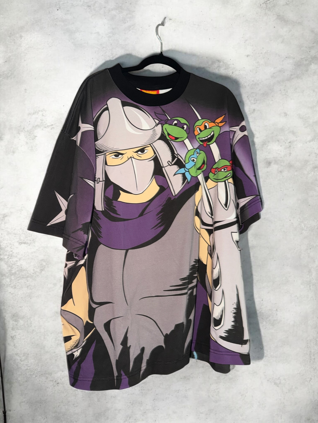 DRIPPING IN VINTY Teenage Mutant Ninja Turtles graphic t-shirt featuring Shredder and the turtles in 90s style