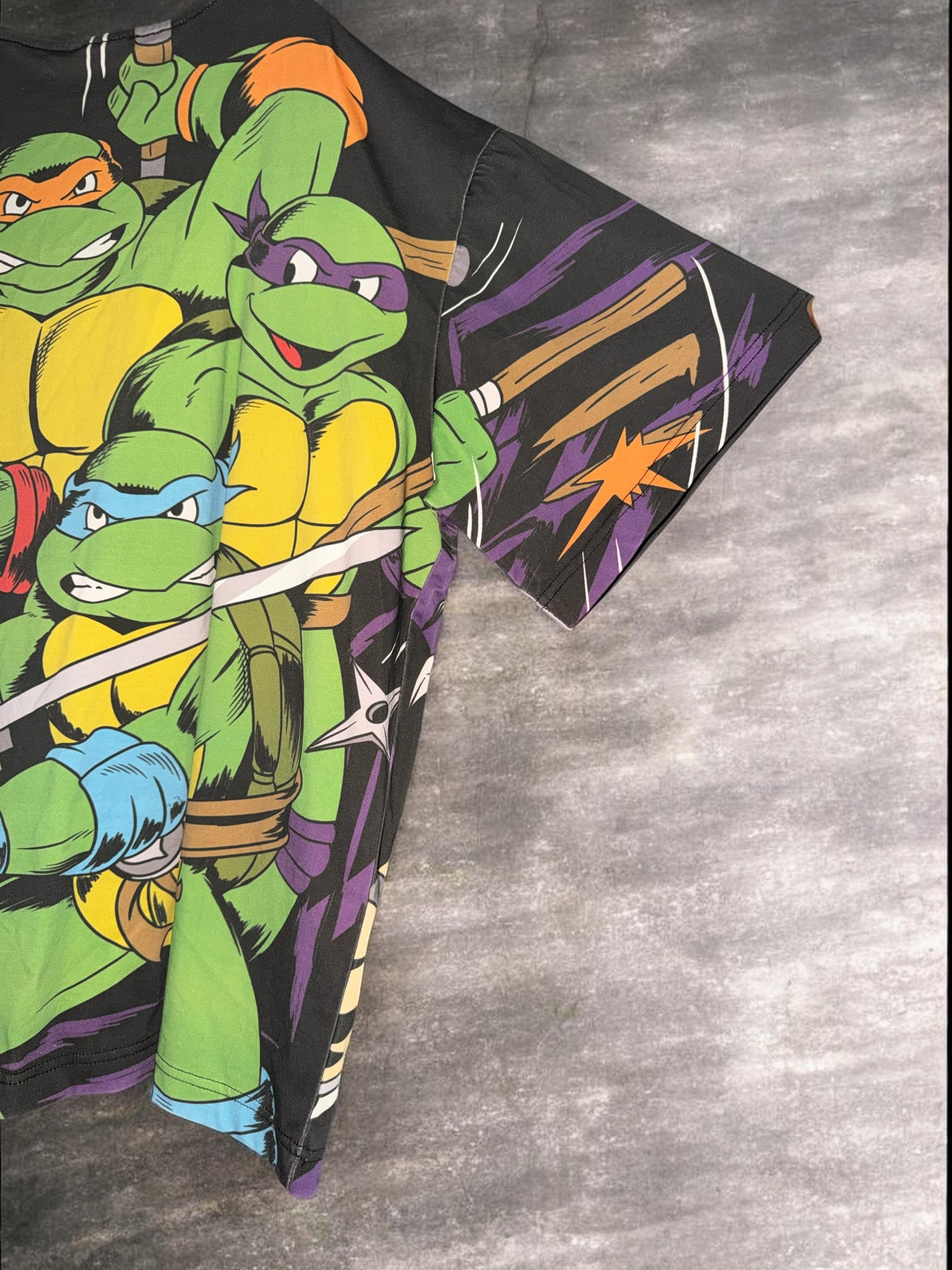 DRIPPING IN VINTY vintage Teenage Mutant Ninja Turtles graphic t-shirt with vibrant 90s animation style print