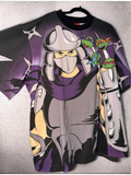 DRIPPING IN VINTY Teenage Mutant Ninja Turtles graphic t-shirt featuring Shredder and the turtles in 90s style