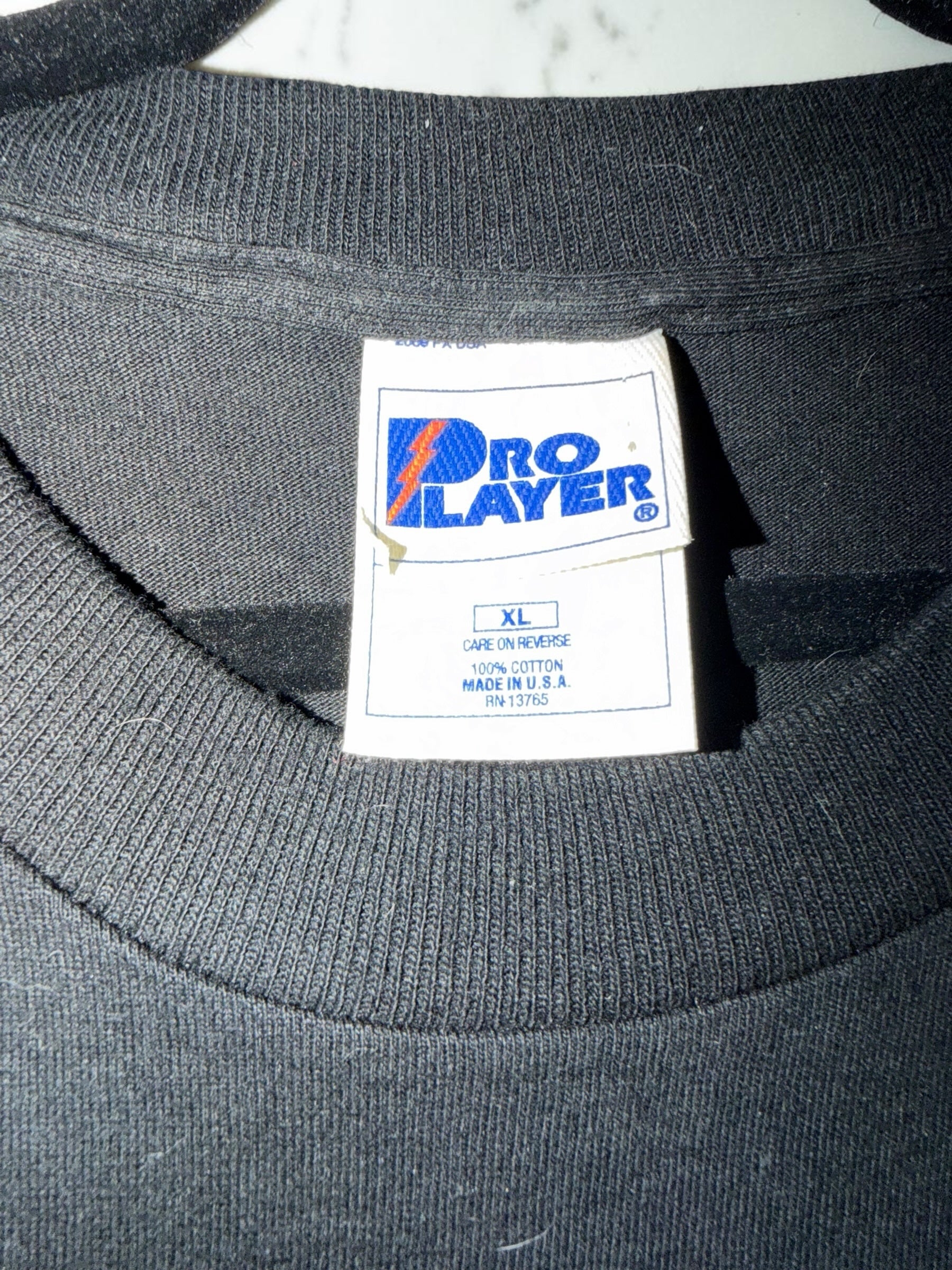 DRIPPING IN VINTY vintage black Pro Player cotton t-shirt tag showing size XL and made in USA label