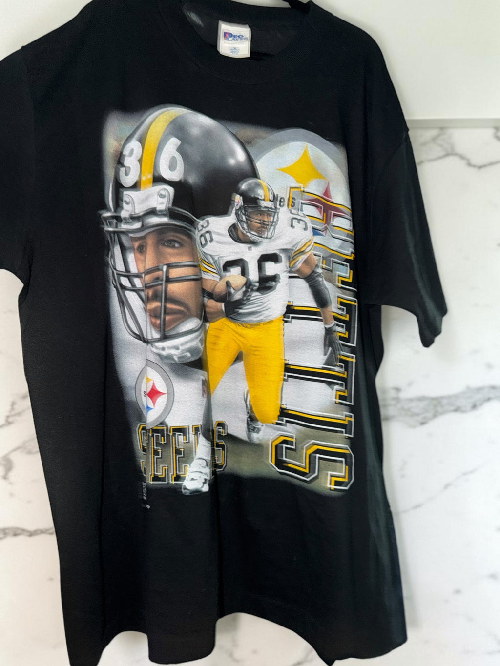 DRIPPING IN VINTY vintage black Pittsburgh Steelers cotton t-shirt with 90s style player graphic and team helmet