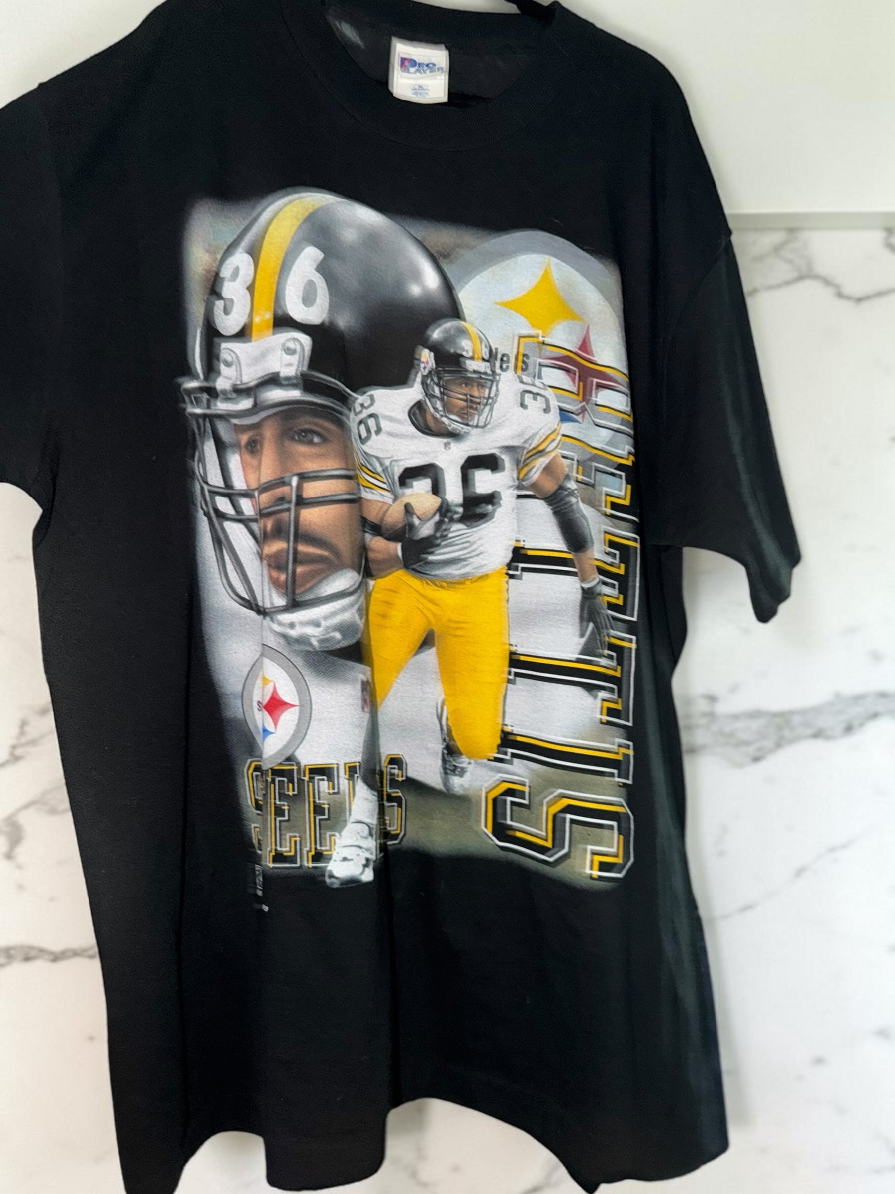 DRIPPING IN VINTY vintage black Pittsburgh Steelers cotton t-shirt with 90s style player graphic and team helmet